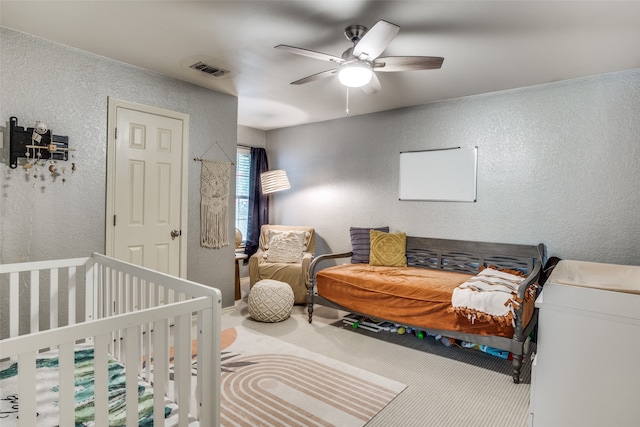 bedroom with ceiling fan and carpet