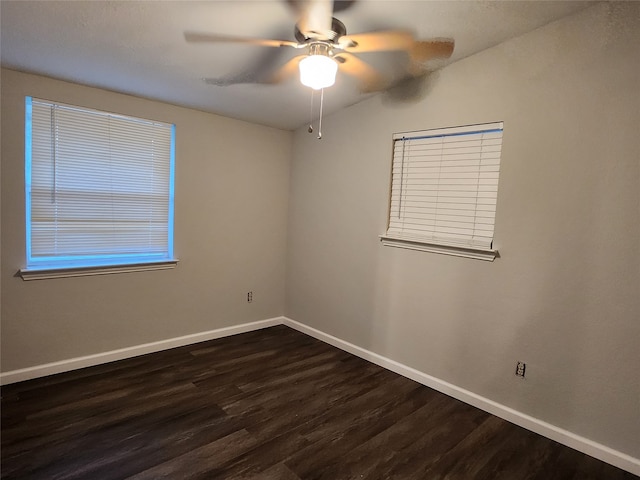 unfurnished room featuring lofted ceiling, ceiling fan, and dark hardwood / wood-style floors