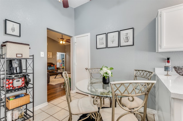 dining space featuring ceiling fan and light hardwood / wood-style flooring