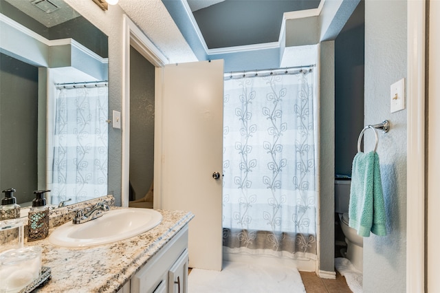 bathroom featuring tile patterned floors, vanity, and toilet