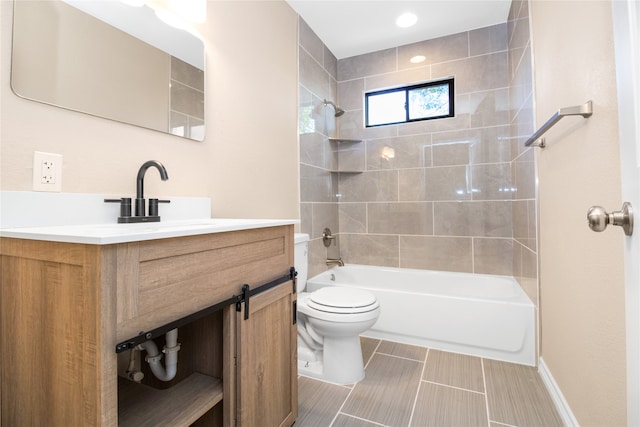 full bathroom featuring vanity, tile patterned flooring, toilet, and tiled shower / bath