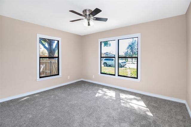 unfurnished room with carpet floors, ceiling fan, and a healthy amount of sunlight