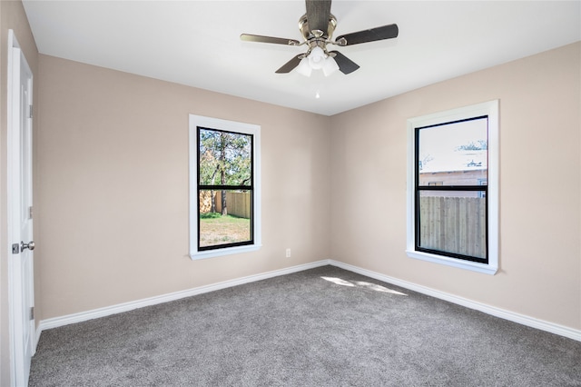 spare room featuring carpet and ceiling fan