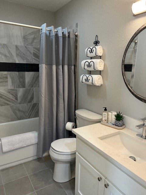 full bathroom featuring toilet, shower / tub combo, vanity, and tile patterned flooring