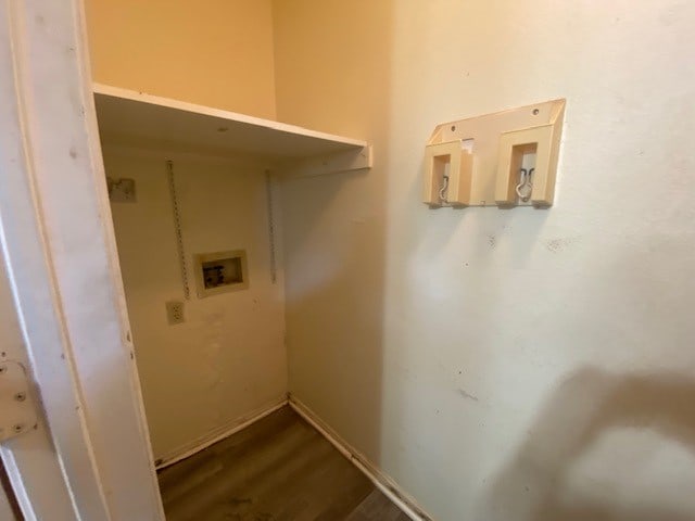 washroom featuring wood-type flooring and hookup for a washing machine