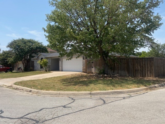 view of front of property with a garage and a front yard