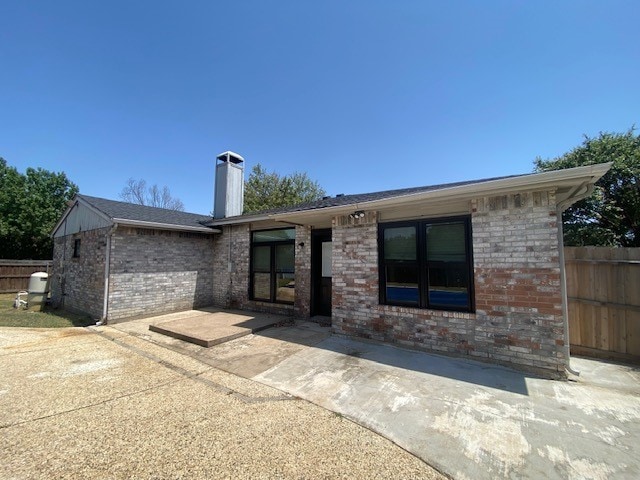 rear view of house with a patio