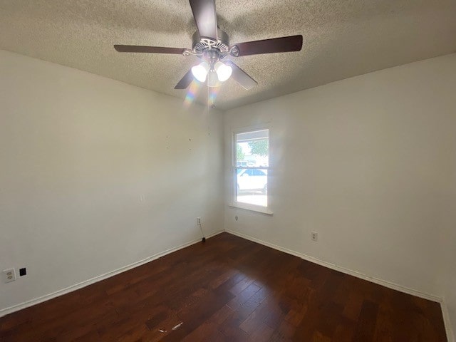 spare room featuring a textured ceiling, hardwood / wood-style floors, and ceiling fan