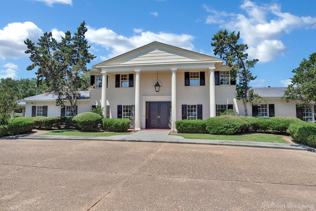 view of greek revival inspired property