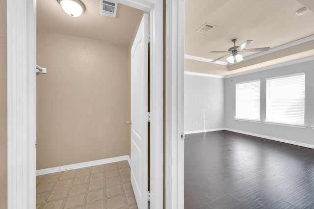 empty room with ceiling fan, ornamental molding, and hardwood / wood-style flooring