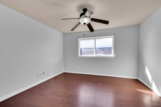 empty room featuring ceiling fan and wood-type flooring