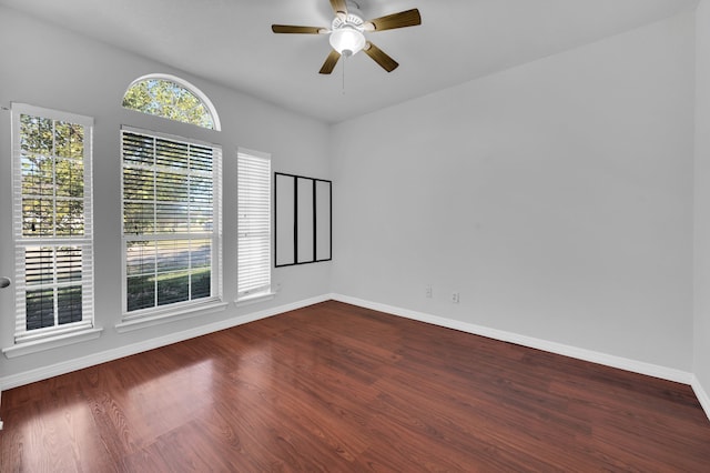 spare room with ceiling fan and hardwood / wood-style flooring