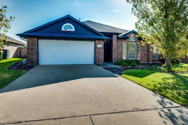 ranch-style house with a front lawn and a garage