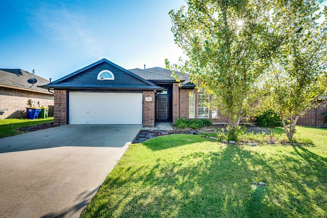 view of front of home with a front lawn and a garage