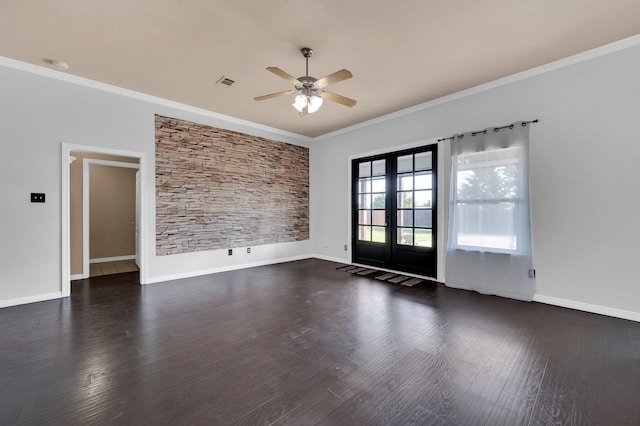 spare room with ceiling fan, dark hardwood / wood-style floors, ornamental molding, and french doors