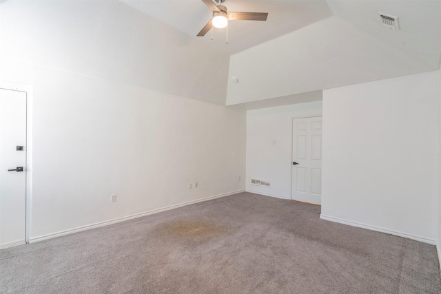 unfurnished room with vaulted ceiling, ceiling fan, and carpet flooring