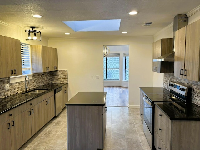 kitchen with sink, hanging light fixtures, stainless steel appliances, ornamental molding, and a kitchen island