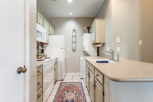 kitchen featuring sink, white appliances, and light tile patterned floors