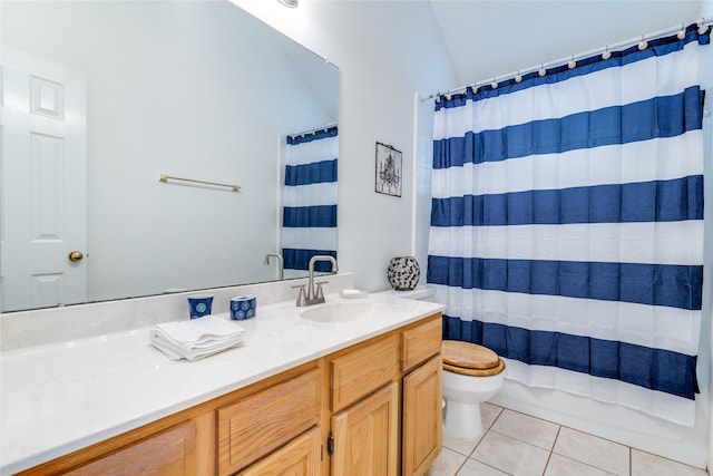 bathroom with tile patterned floors, vanity, and toilet