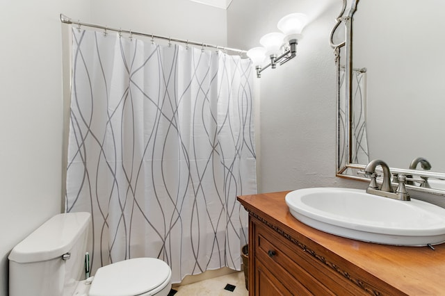 bathroom with vanity, toilet, and a shower with shower curtain