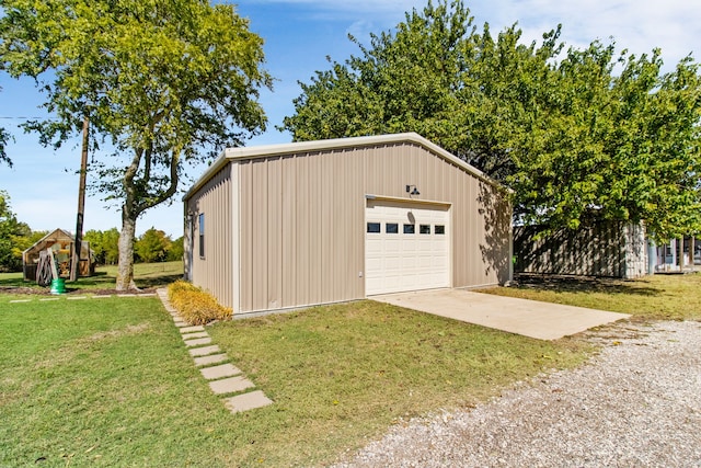 garage featuring a yard