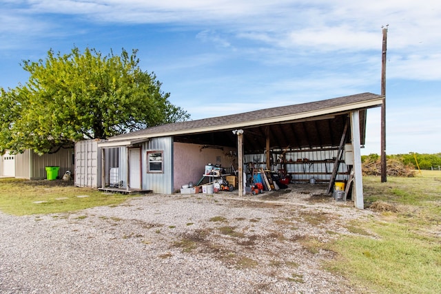 view of outbuilding with a yard