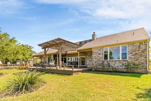 rear view of house featuring a pergola, a yard, and a wooden deck