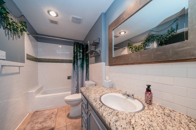 full bath with tile walls, shower / bathtub combination with curtain, toilet, and visible vents