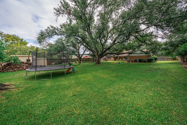 view of yard featuring a trampoline