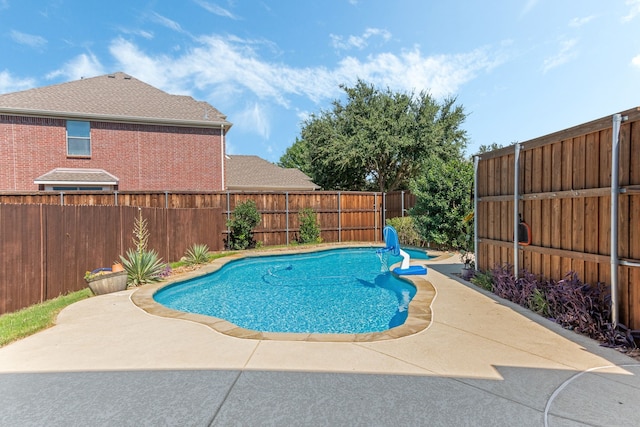 view of pool featuring a patio area, a fenced in pool, and a fenced backyard