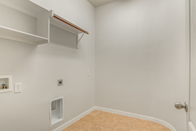 washroom featuring baseboards, light tile patterned floors, laundry area, hookup for a washing machine, and electric dryer hookup