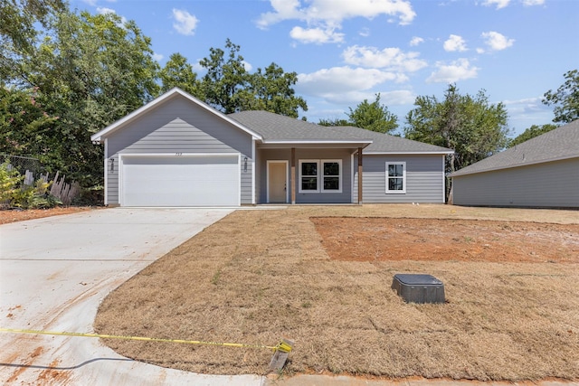 ranch-style house featuring driveway and an attached garage