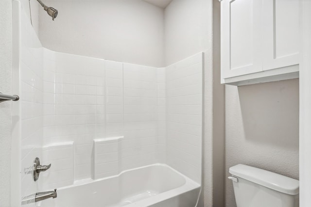 bathroom featuring bathing tub / shower combination and toilet