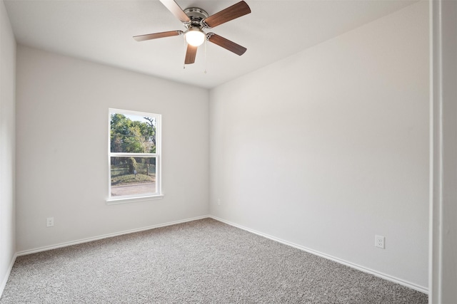 empty room featuring ceiling fan, carpet, and baseboards