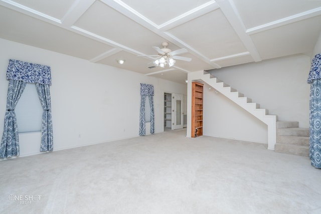 living room featuring ceiling fan and carpet