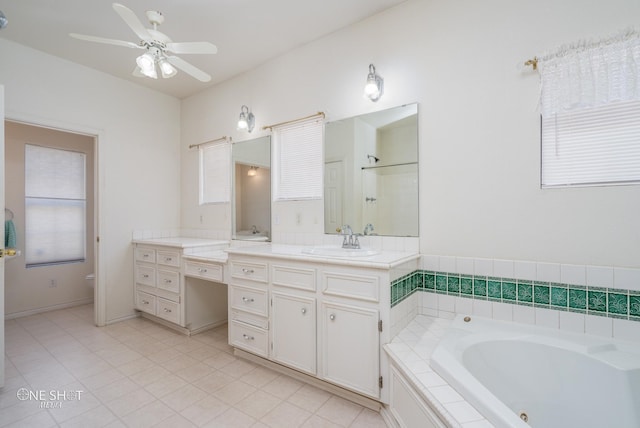 bathroom featuring a bathing tub, tile patterned flooring, vanity, ceiling fan, and toilet