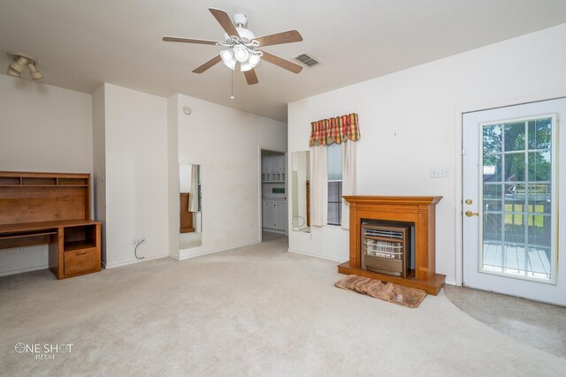 carpeted living room with ceiling fan