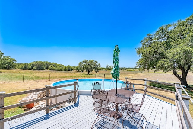 wooden terrace with a rural view