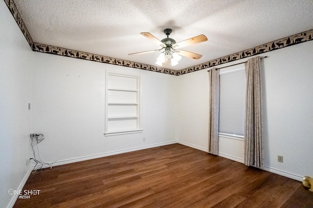 unfurnished room featuring ceiling fan, dark hardwood / wood-style flooring, and a textured ceiling