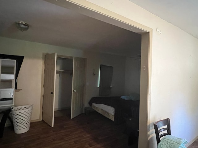 bedroom with hardwood / wood-style floors and a closet