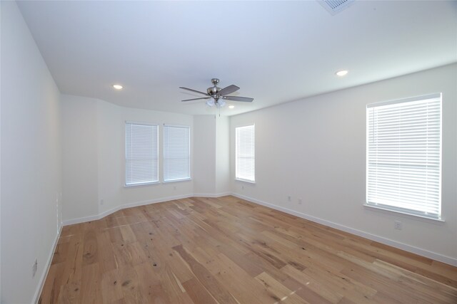 unfurnished room featuring ceiling fan and light wood-type flooring