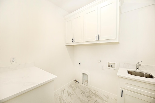 laundry room featuring cabinets, hookup for a washing machine, hookup for an electric dryer, sink, and hookup for a gas dryer