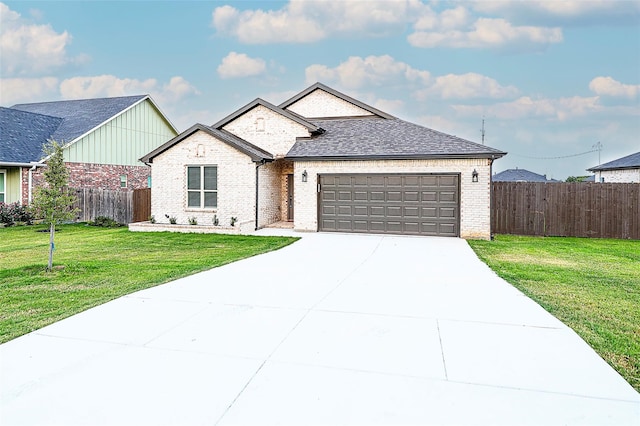 view of front facade with a front lawn and a garage