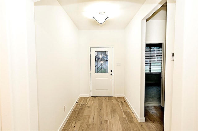 doorway with light hardwood / wood-style flooring