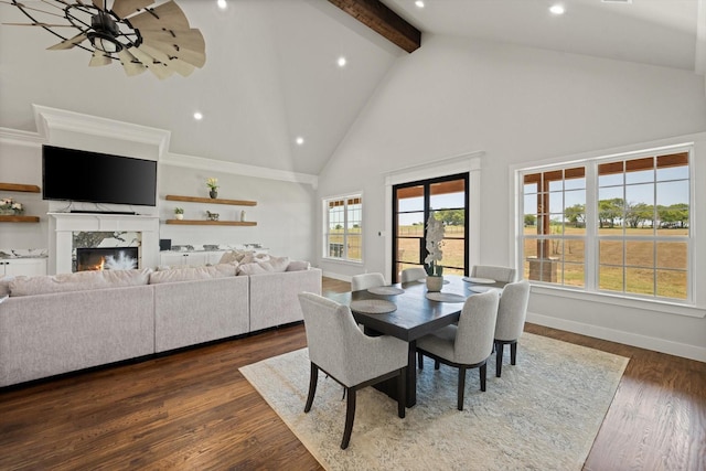 dining area with dark wood-style floors, beam ceiling, a fireplace, high vaulted ceiling, and baseboards