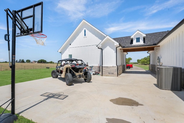 view of patio with driveway and cooling unit