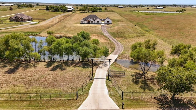 aerial view with a rural view and a water view