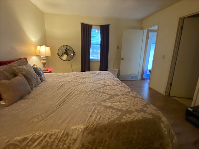 bedroom with hardwood / wood-style floors