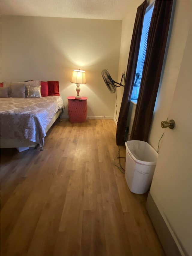 bedroom featuring hardwood / wood-style flooring