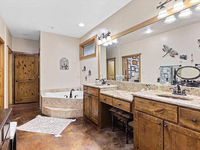 bathroom with vanity and a relaxing tiled tub